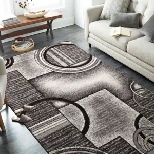 Originální šedohnědý koberec s motivem abstraktních kruhů Šířka: 120 cm | Délka: 170 cm